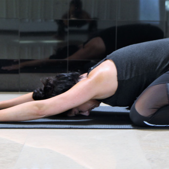 Instructor teaching a stretching class